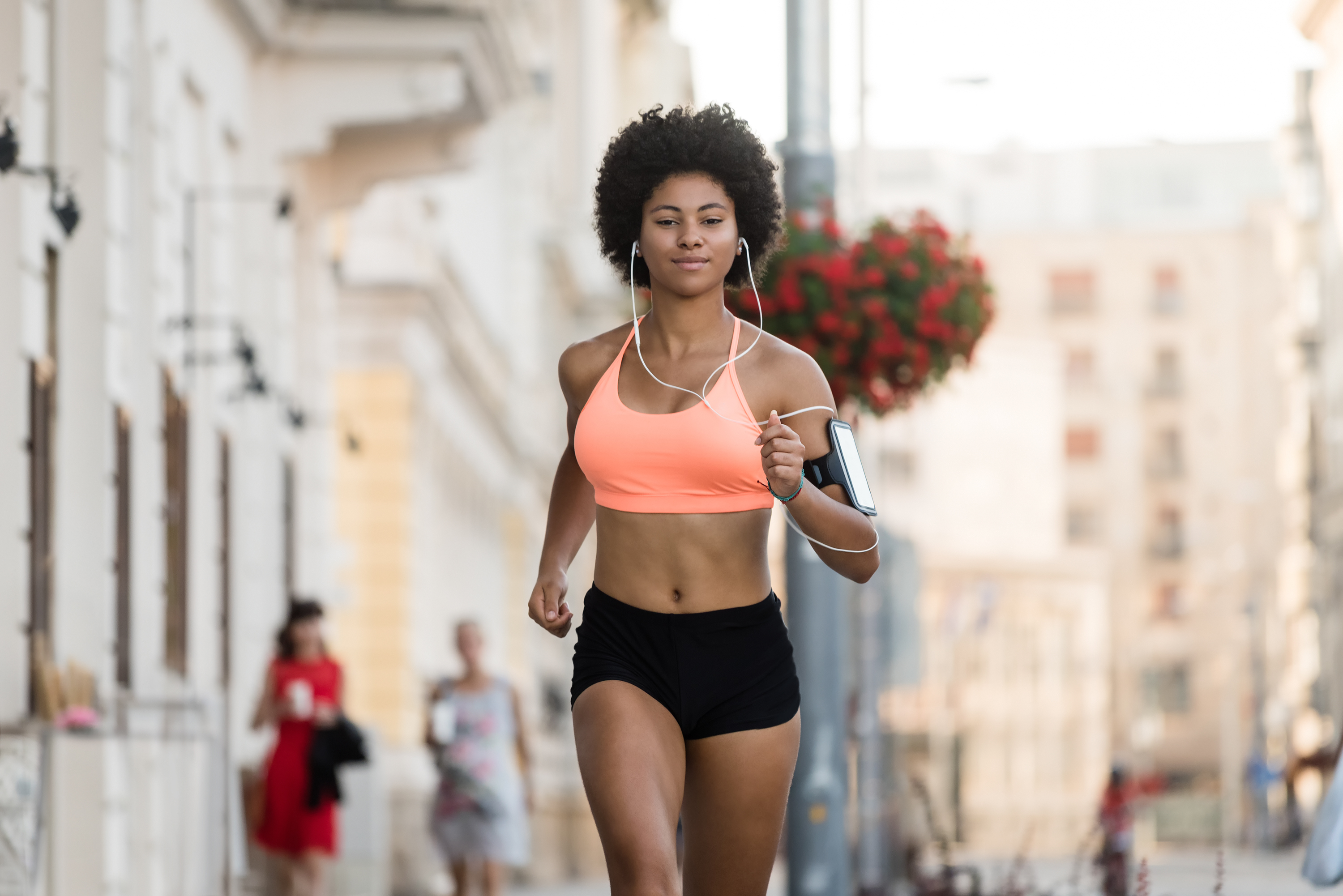 Young athletic woman running outdoors