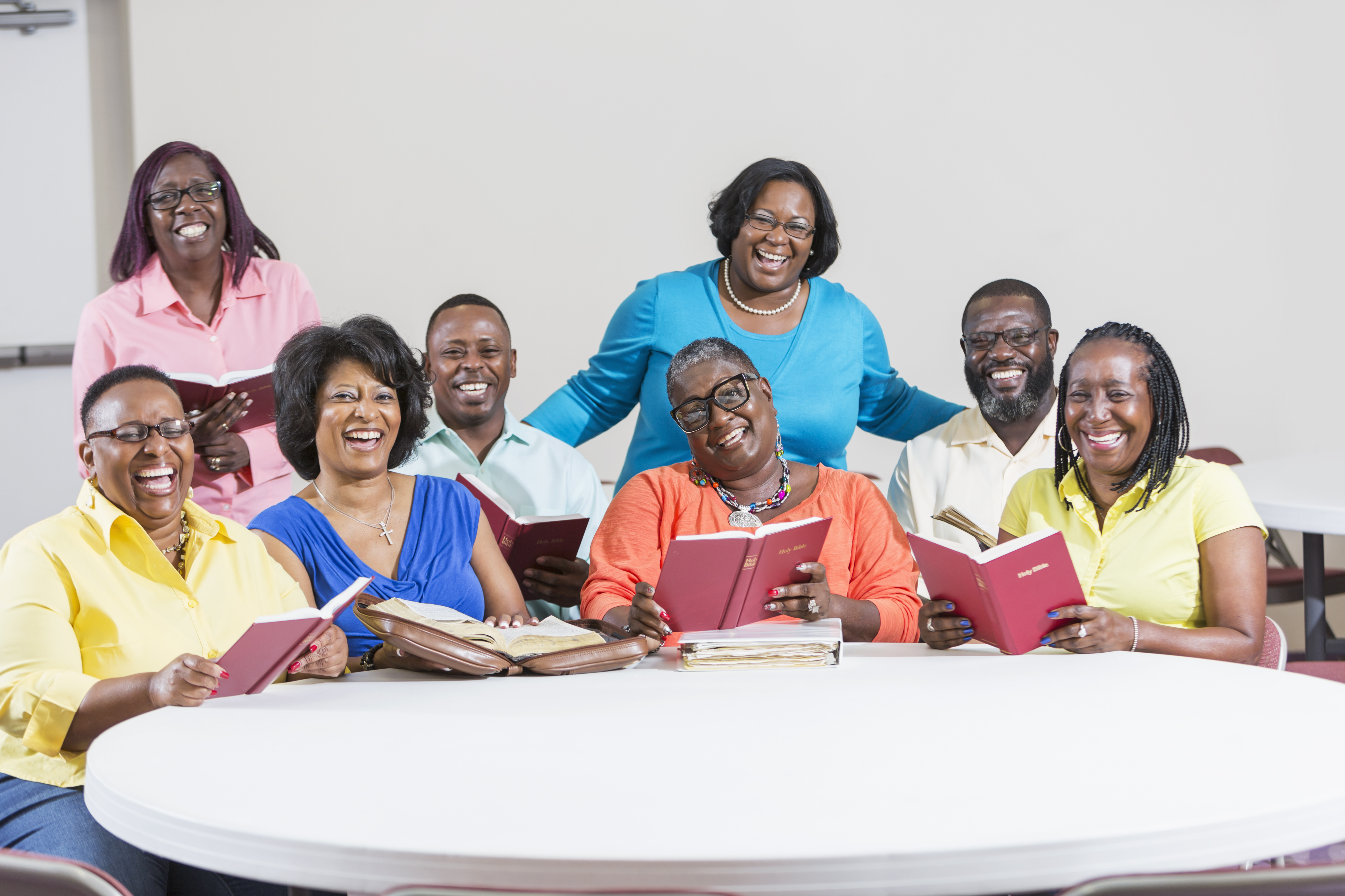 African American men and women at bible study meeting